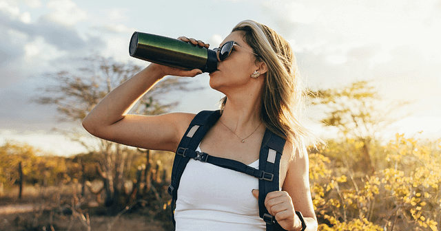 Woman hiking with water bottle